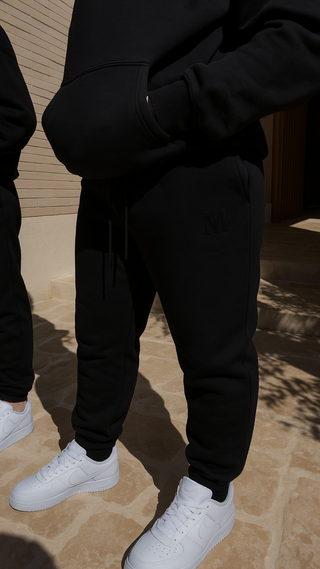 Black Empire Plush sweatpants made from 100% cotton with 3D tonal INTIMISSY branding