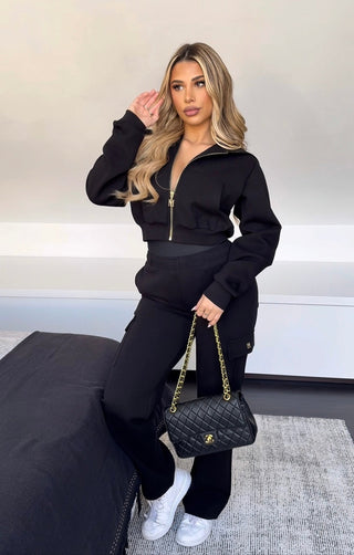 INTIMISSY Studio Plush Crop Jacket in Caviar – women’s black plush cropped jacket with gold zip, matching cargo pants streetwear set