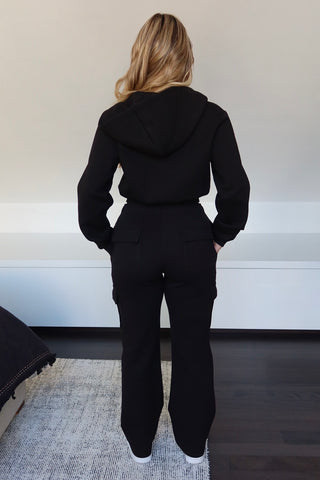 INTIMISSY Studio Plush Crop Jacket in Caviar – women’s black plush cropped jacket with gold zip, matching cargo pants streetwear set