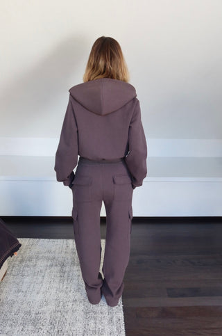 Back view of INTIMISSY Studio Plush Cargo Pants in Truffle Charcoal with soft plush texture and straight-leg silhouette
