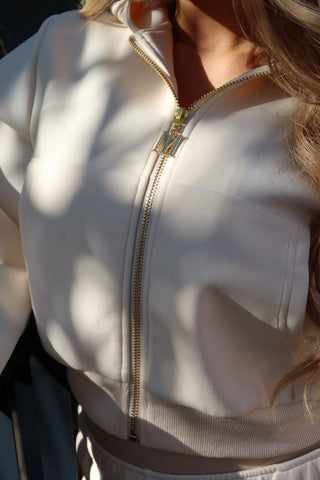 INTIMISSY Studio Plush Crop Jacket in Soufflé – women’s premium cropped zip jacket with gold hardware, soft plush streetwear set