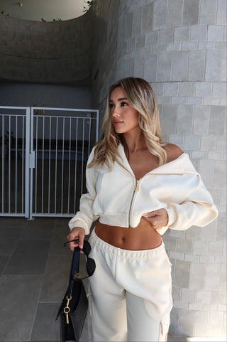 INTIMISSY Studio Plush Crop Jacket in Soufflé – women’s premium cropped zip jacket with gold hardware, soft plush streetwear set