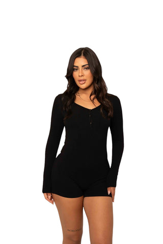 INTIMISSY® Reina romper front view on model with V-neckline and slim fit, showing 3-button enclosure and sculpted silhouette