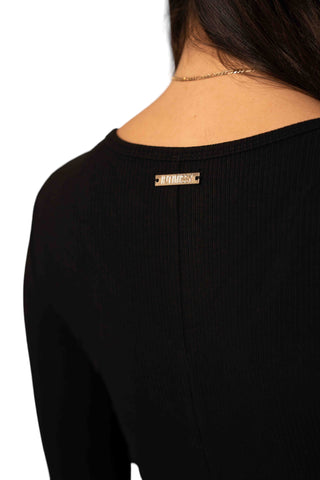 INTIMISSY® Close up of signature gold-toned logo plaque on Reina romper